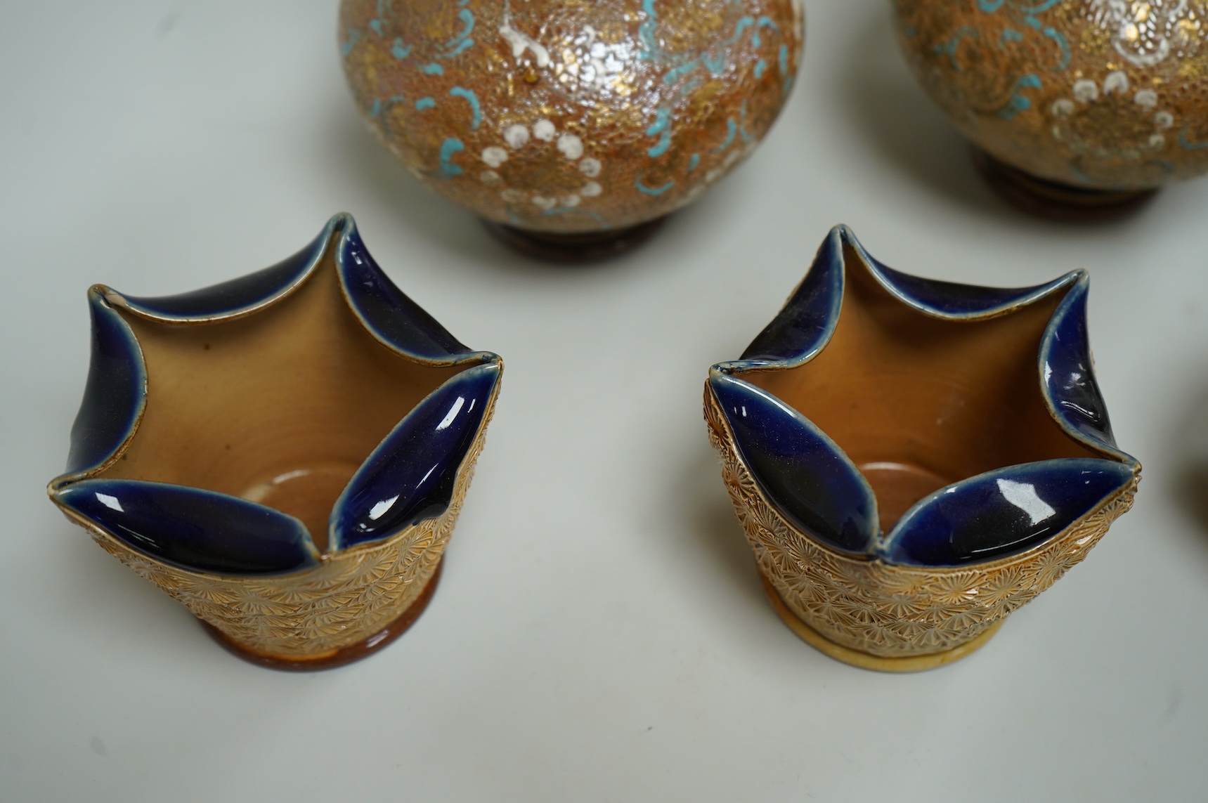 A pair of Royal Doulton Slater’s patent vases, 26cm high and pots and a jug together with a collection of miniature stoneware pots jugs and a pair of peppers